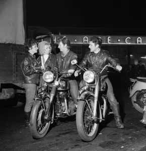 Rocker boys on motorcycles - called 'sickles' - talking to girls Rocker boys on motorcycles - called 'sickles' - talking to girls