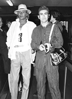 Rod Stewart and Elton John arriving at an airport. February 1978 Rod Stewart and Elton John arriving at an airport. February 1978