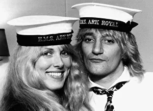 Rod Stewart singer with Alana Hamilton wearing Royal Navy HMS Ark Royal Caps during a Rod Stewart singer with Alana Hamilton wearing Royal Navy HMS Ark Royal Caps during a