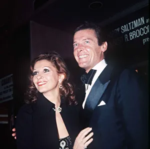 Roger Moore Actor and his wife Luisa at the premiere of the film The Man With The Golden Roger Moore Actor and his wife Luisa at the premiere of the film The Man With The Golden