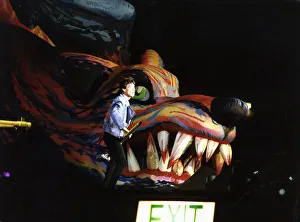 Rolling Stones: Mick Jagger on stage standing beside a Giant inflatable Dragons Head with Rolling Stones: Mick Jagger on stage standing beside a Giant inflatable Dragons Head with