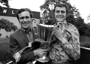 Ron Harris and Keith Weller of Chelsea hold the trophy aboard sn open top bus on a Ron Harris and Keith Weller of Chelsea hold the trophy aboard sn open top bus on a