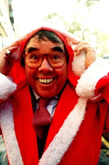 Ronnie Corbett comedian dresses as Father Christmas at a charity auction in London Ronnie Corbett comedian dresses as Father Christmas at a charity auction in London