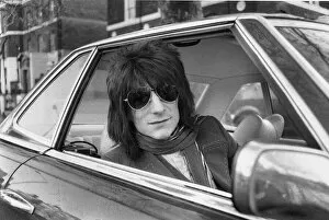 Images Dated 26th November 1973: Ronnie Wood Guitar player with the Rolling Stones drives away from his Richmond home