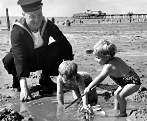 Royal Navy sailor A Ryder enjoys his time on leave as he spends the day with his two sons Royal Navy sailor A Ryder enjoys his time on leave as he spends the day with his two sons