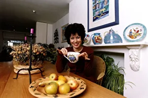 Ruby Wax TV Presenter sitting in her kitchen with a mug in her hand in Woodstock Ruby Wax TV Presenter sitting in her kitchen with a mug in her hand in Woodstock