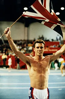 Runner Tom McKean holding up Union Jack in the Kelvin Hall after winning race athletics Runner Tom McKean holding up Union Jack in the Kelvin Hall after winning race athletics