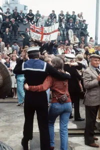 A sailor from HMS Arrow walks along arm in arm with his wife after arriving back from A sailor from HMS Arrow walks along arm in arm with his wife after arriving back from
