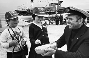 Sarah and Anthony Hanlon offer their congratulations to the lifeboat coxswain John Sarah and Anthony Hanlon offer their congratulations to the lifeboat coxswain John
