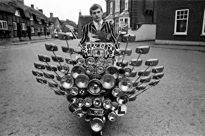 School leaver Bryn Owen aged 17 with his Vespa scooter, which has 34 mirrors School leaver Bryn Owen aged 17 with his Vespa scooter, which has 34 mirrors