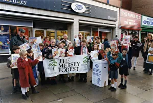 Schoolchildren using old Christmas cards to spread the message about recycling Schoolchildren using old Christmas cards to spread the message about recycling