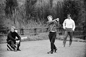 Scotland's Billy Bremner tees off watched by Denis Law during a game of golf at Scotland's Billy Bremner tees off watched by Denis Law during a game of golf at