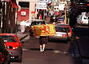 Scots Fan World Cup France 1998 Football Walking middle of road wearing a Scots Fan World Cup France 1998 Football Walking middle of road wearing a