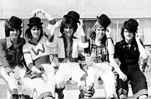 Scottish pop group The Bay City Rollers, sitting on a bench Wearing bowler hats Scottish pop group The Bay City Rollers, sitting on a bench Wearing bowler hats