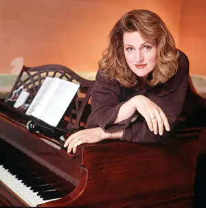 Scottish singer and actress Barbara Dickson poses draped over a piano Scottish singer and actress Barbara Dickson poses draped over a piano