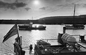 The sea is pool-placid as the sun goes down and the Barry lifeboat stands at her harbour The sea is pool-placid as the sun goes down and the Barry lifeboat stands at her harbour