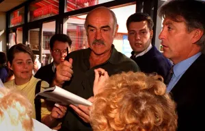 Sean Connery with moustache and mouth open holding a pen Sean Connery with moustache and mouth open holding a pen