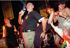 Sean Connery singing on stage with ladies June 1998 Sean Connery singing on stage with ladies June 1998