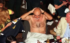 Sean Connery takes off his shirt June 1998 and puts on Scotland top given to him by his Sean Connery takes off his shirt June 1998 and puts on Scotland top given to him by his