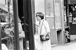 Senior Citizen seen wearing a crown of flowers, New York, USA, June 1984 Senior Citizen seen wearing a crown of flowers, New York, USA, June 1984