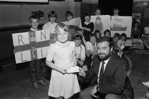 Seven-year old Adele Brooke presents a £588 cheque from Dalton Junior School to Mr Seven-year old Adele Brooke presents a £588 cheque from Dalton Junior School to Mr
