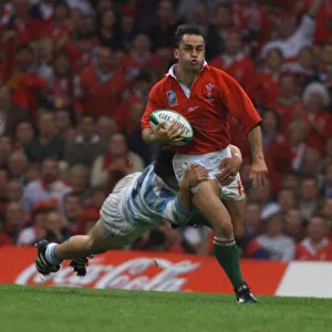 Shane Howarth Hughes breaks through in October 1999, during the Wales v Argentina match Shane Howarth Hughes breaks through in October 1999, during the Wales v Argentina match