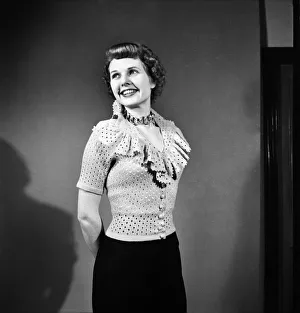 Sheila Sim is wearing frilly Jarnpon Blouse. February 1952 C6324 Sheila Sim is wearing frilly Jarnpon Blouse. February 1952 C6324