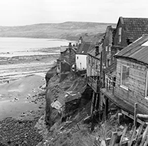 Shored up houses on the cliffs at Robin Hood's Bay, North Yorkshire. 3rd March 1970 Shored up houses on the cliffs at Robin Hood's Bay, North Yorkshire. 3rd March 1970