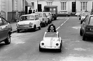 Images Dated 9th April 1980: Sian Lloyd, who works at Walt Disney Productions, driving a replica of Herbie in Primrose