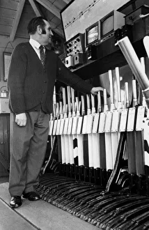 A signalman waiting for trains to pass through before changing signals A signalman waiting for trains to pass through before changing signals