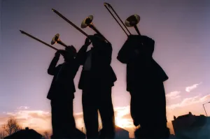 Silhouettes of men playing trombones on December 18, 1997 Silhouettes of men playing trombones on December 18, 1997
