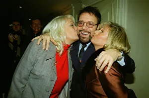Singer Cliff Richard receives a kss on the cheek from Eastenders actress Wendy Richard Singer Cliff Richard receives a kss on the cheek from Eastenders actress Wendy Richard