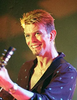 Singer David Bowie July 1997 Playing the guitar live on stage at the Glasgow Barrowlands Singer David Bowie July 1997 Playing the guitar live on stage at the Glasgow Barrowlands