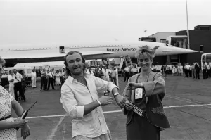 Singer Phil Collins & wife Jill Travelman at London Heathrow Airport Singer Phil Collins & wife Jill Travelman at London Heathrow Airport