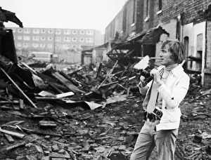 Singer Vince Hill is also an enthusiastic photographer, he is seen here recording Singer Vince Hill is also an enthusiastic photographer, he is seen here recording