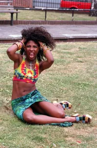 SINITTA SITTING IN PARK WITH HER HANDS IN HER HAIR IN PROMOTIONAL HAIR PHOTOCALL SINITTA SITTING IN PARK WITH HER HANDS IN HER HAIR IN PROMOTIONAL HAIR PHOTOCALL