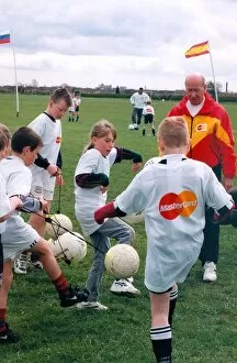 Images Dated 1st May 1996: Sir Bobby Charlton gives tips to youngsters on Bullocksteads Sports Ground in May 1996 in