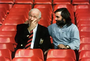 SIR MATT BUSBY AND GEORGE BEST SEATED IN FOOTBALL STANDS OF OLD TRAFFORD .2/10/90 SIR MATT BUSBY AND GEORGE BEST SEATED IN FOOTBALL STANDS OF OLD TRAFFORD .2/10/90