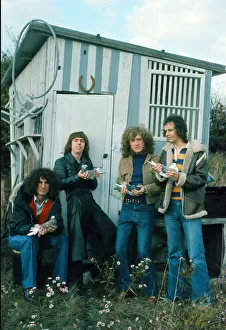 Slade band members Don Powell, Dave Hill, Jim Lea and Noddy Holder on the set of their Slade band members Don Powell, Dave Hill, Jim Lea and Noddy Holder on the set of their