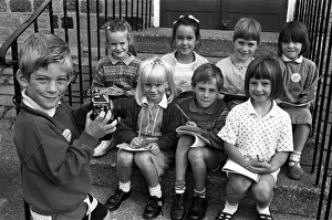 Smile please! Six-year-old Adam Bedford puts his reporter 'colleagues" Smile please! Six-year-old Adam Bedford puts his reporter 'colleagues"