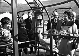 A smiling Queen Elizabeth II watches children in the play area at the opening of Aberfan A smiling Queen Elizabeth II watches children in the play area at the opening of Aberfan