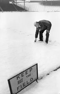 Snow bound Ibrox Park head groundsman Dave Marshall surveys the pitch after heavy snow Snow bound Ibrox Park head groundsman Dave Marshall surveys the pitch after heavy snow
