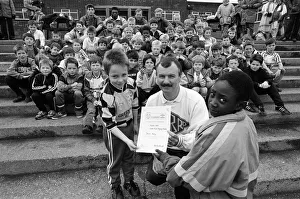 Soccer smiles from Gregory Wadsworth (front left) and Damien Wright as they receive their Soccer smiles from Gregory Wadsworth (front left) and Damien Wright as they receive their