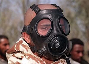 Images Dated 12th October 1990: A soldier wears a gas mask in training Oct 1990 during the Gulf crisis