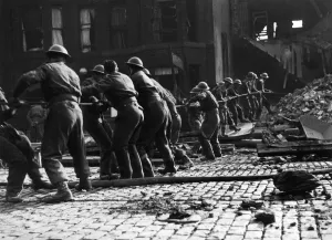 Soldiers of the 8th Manchester Regiment at Ardwick Green working together to clear Soldiers of the 8th Manchester Regiment at Ardwick Green working together to clear