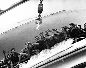 Soldiers aboard the QE2 reaching out for a bra that is up for grabs belonging to a Lance Soldiers aboard the QE2 reaching out for a bra that is up for grabs belonging to a Lance