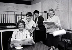 Four sporting ladies smiling after placing winning bets at a Ladies only betting shop in Four sporting ladies smiling after placing winning bets at a Ladies only betting shop in