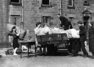 Squatters moving into derelict housing in Barlinnie, Glasgow, August 1946 Squatters moving into derelict housing in Barlinnie, Glasgow, August 1946