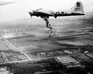 Starving Dutch population bombed with food -- streaming from the bomb bay of a Starving Dutch population bombed with food -- streaming from the bomb bay of a