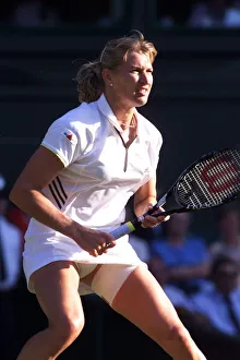 Steffi Graf tennis player at Wimbledon July 1999 with a strapped thigh while playing with Steffi Graf tennis player at Wimbledon July 1999 with a strapped thigh while playing with